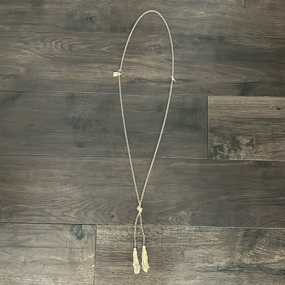 Long gold necklace.